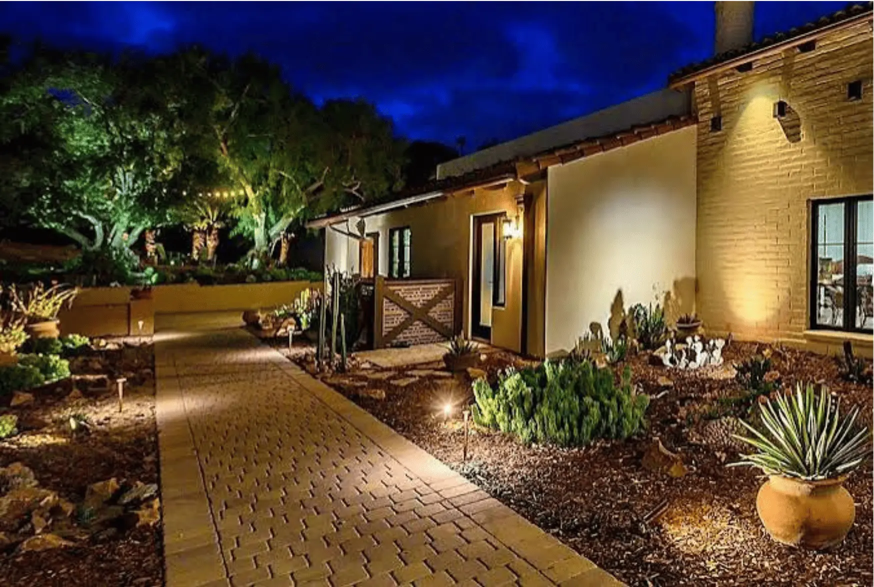 LED landscape lighting along a paver walkway at a Lubbock home