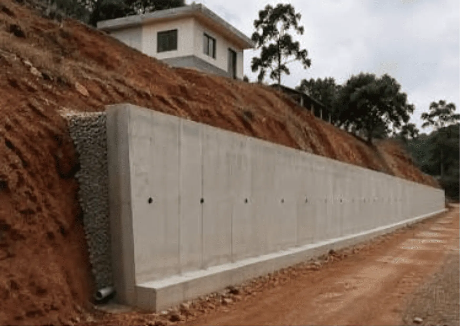 Stone retaining wall built for slope control on a Lubbock property
